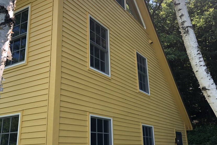 Cooper Hill paint job by Bushnell on a yellow house