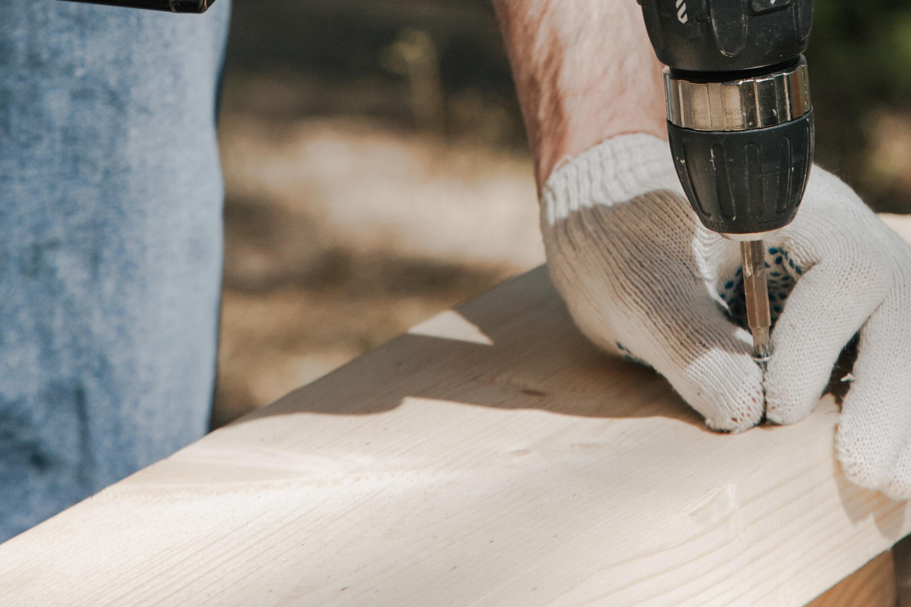 man drilling flooring